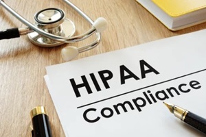 hippa compliance application and stethoscope on a desk