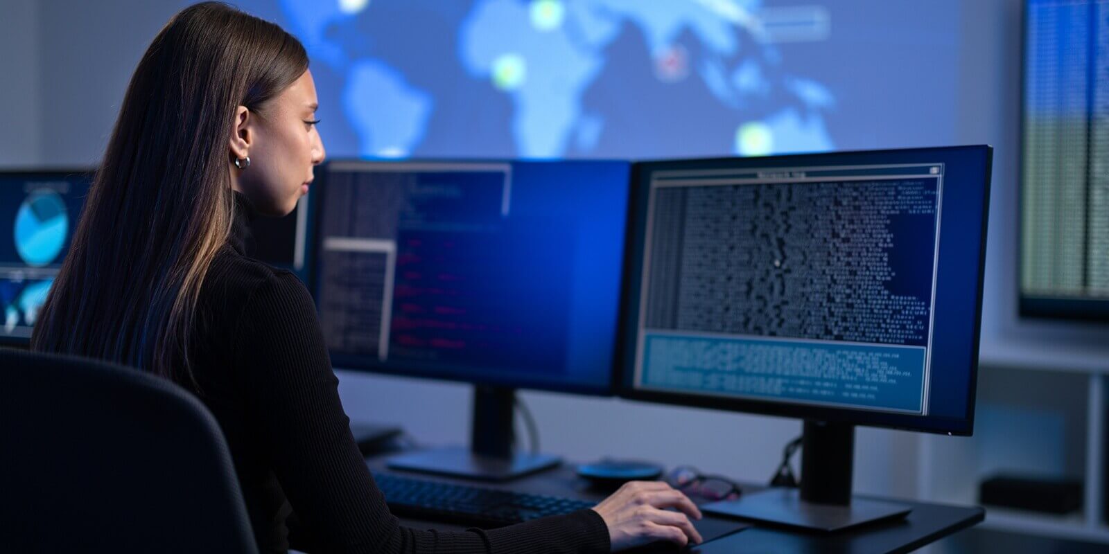 busy female IT consultant in cyber security team working to prevent security threats