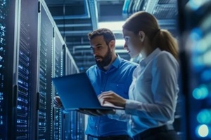 male female employee working in server room